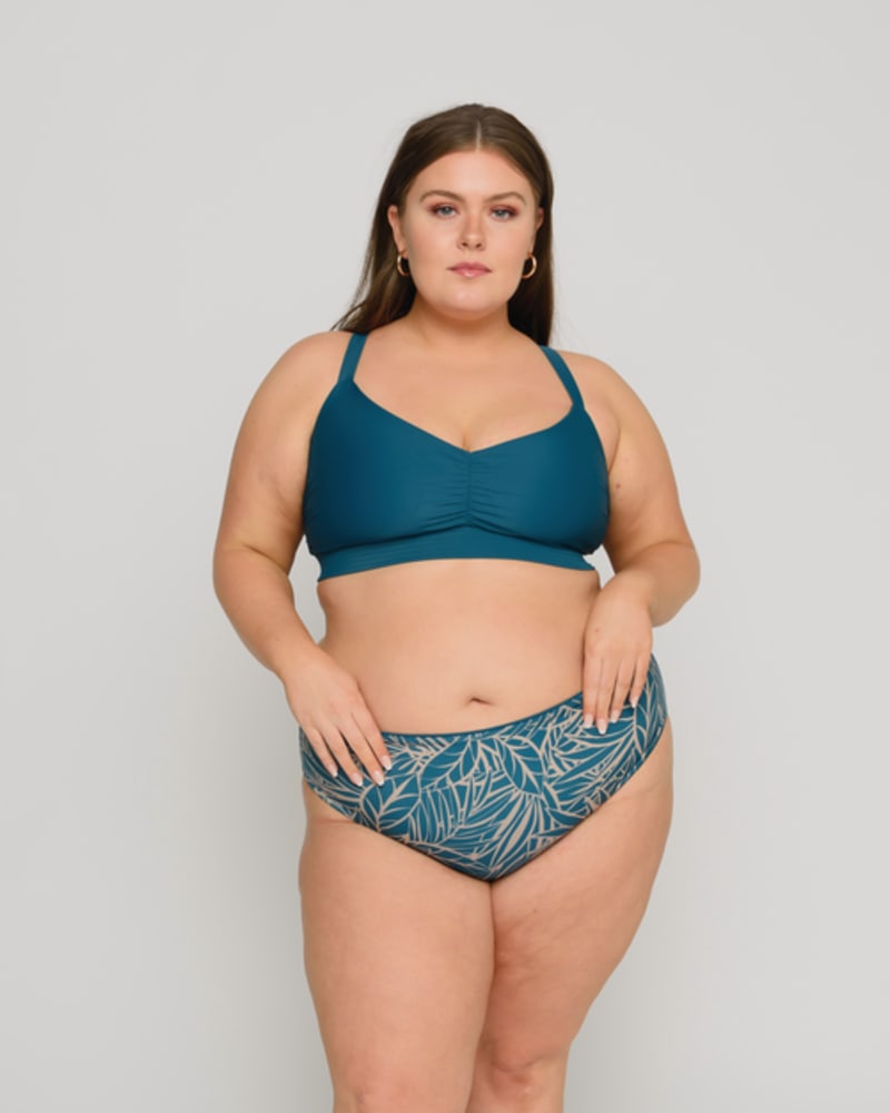 Front of a model wearing a size 10/12 Maria Midrise Bottoms in Amalfi Blue/Palm by Wild Isles. | dia_product_style_image_id:251698